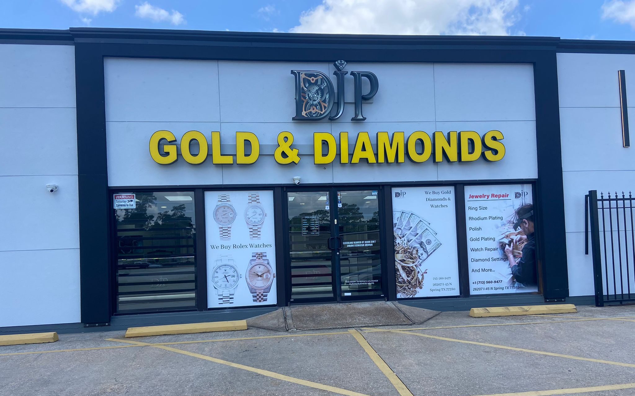 Front exterior of DJP Diamonds Woodlands showroom in The Woodlands-Spring, Texas, with luxury jewelry signage and window displays